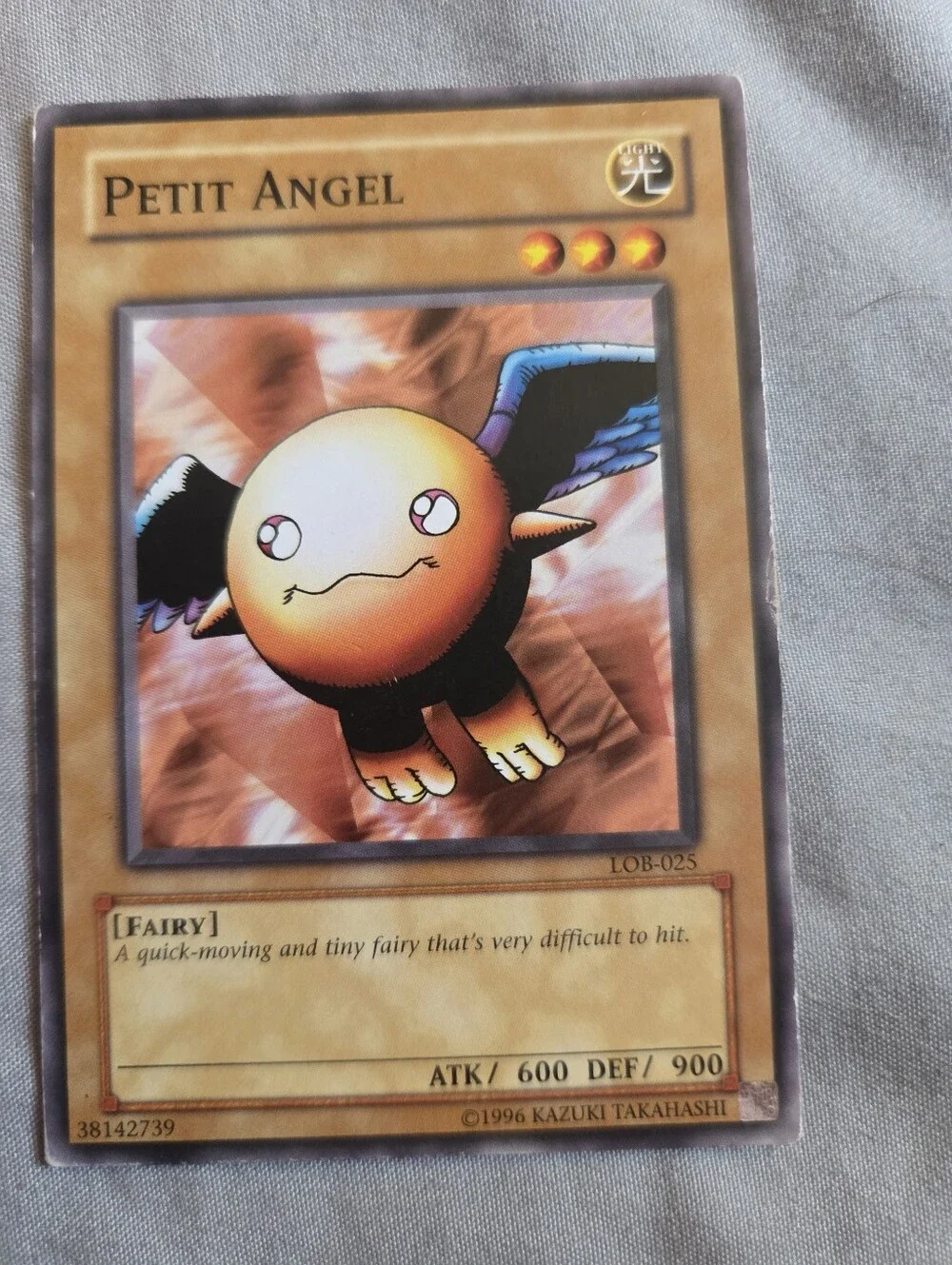 Petit Angel Trading Card - Brown and Blue Collectible
